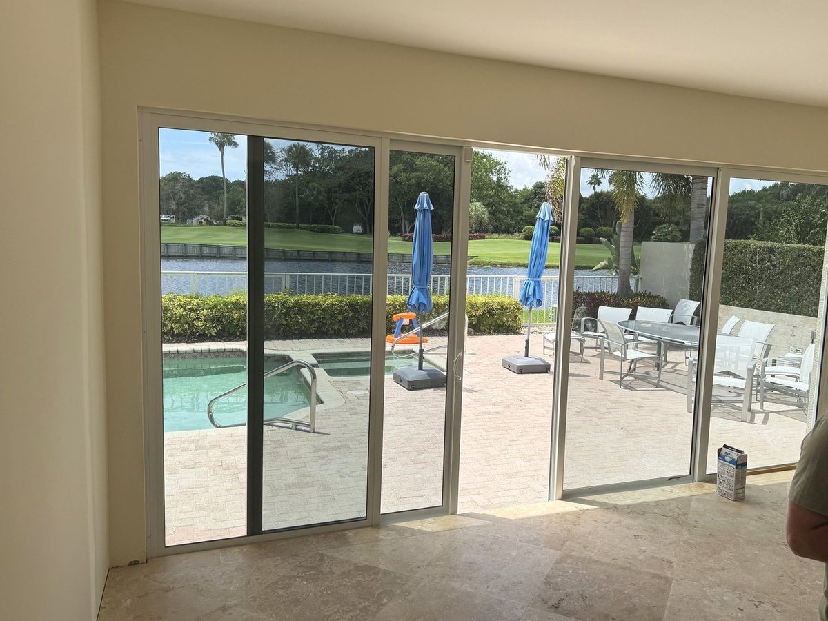 Finished glass patio enclosure looking out to the pool